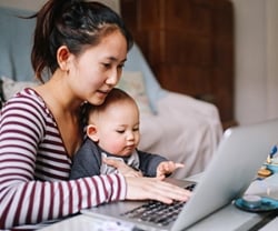 Student holding her newborn