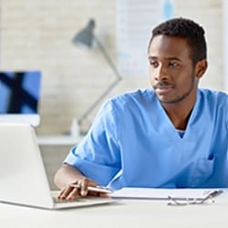 Registered Nurse using Laptop