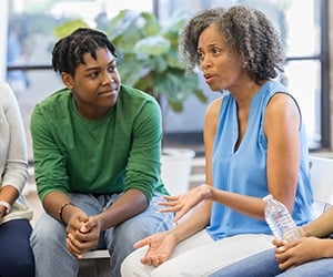 Professor talking to group of students