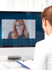 Two professionals working via video chat