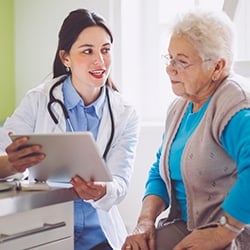 Nurse talking with elderly woman